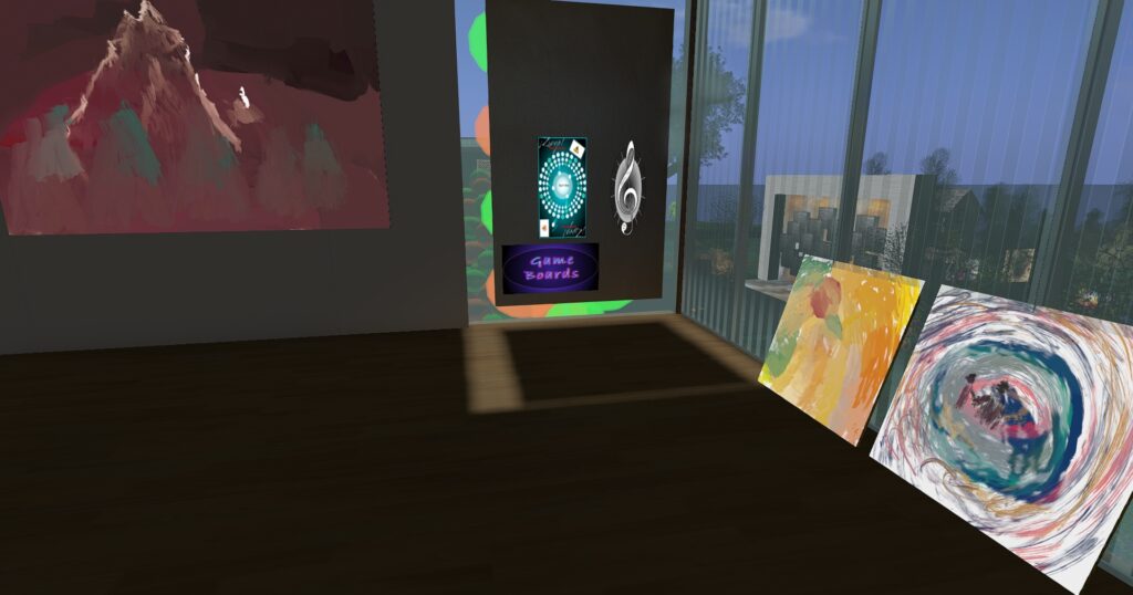 Upstairs inside the Virtual Ability art gallery looking at 3 more of Itico's paintings and two game boards Will created in a game development class.